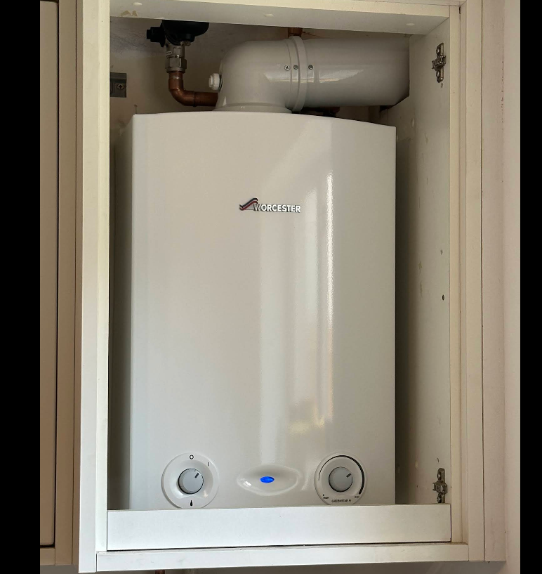 Worcester Bosch combi boiler fitted inside a kitchen wall unit