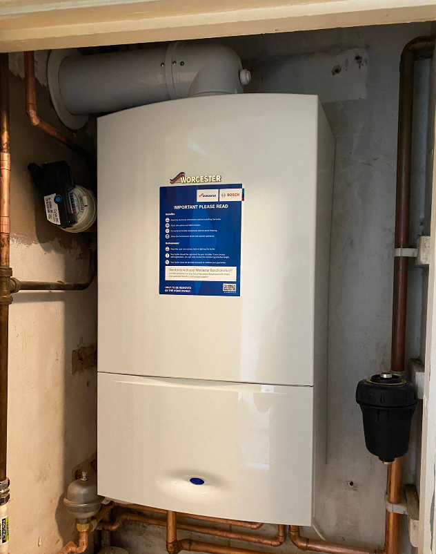 Worcester Bosch combi boiler fitted in a cupboard